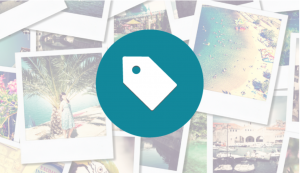 The icon of a tag overlaying a cluster of photographs.