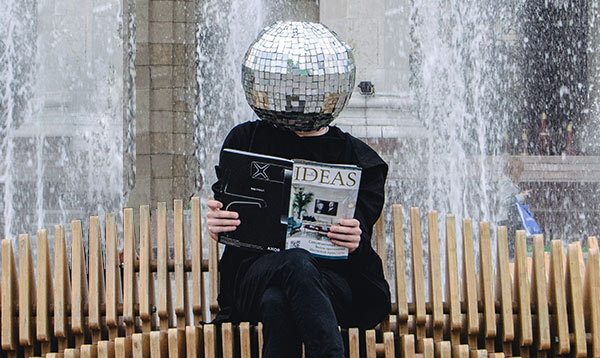 A person with a disco ball for a head.