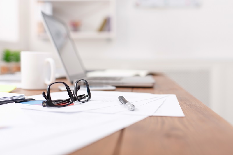 A picture of a desk with a laptop.