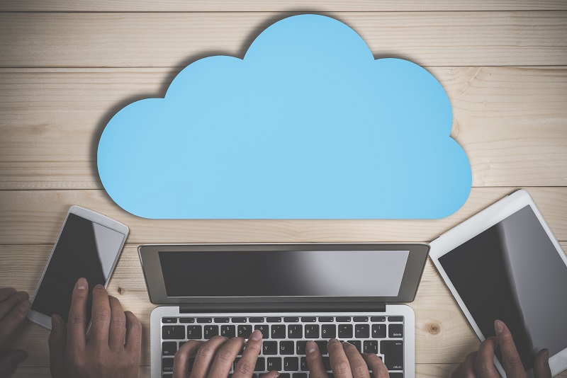 Picture of a laptop with an animated cloud above it.