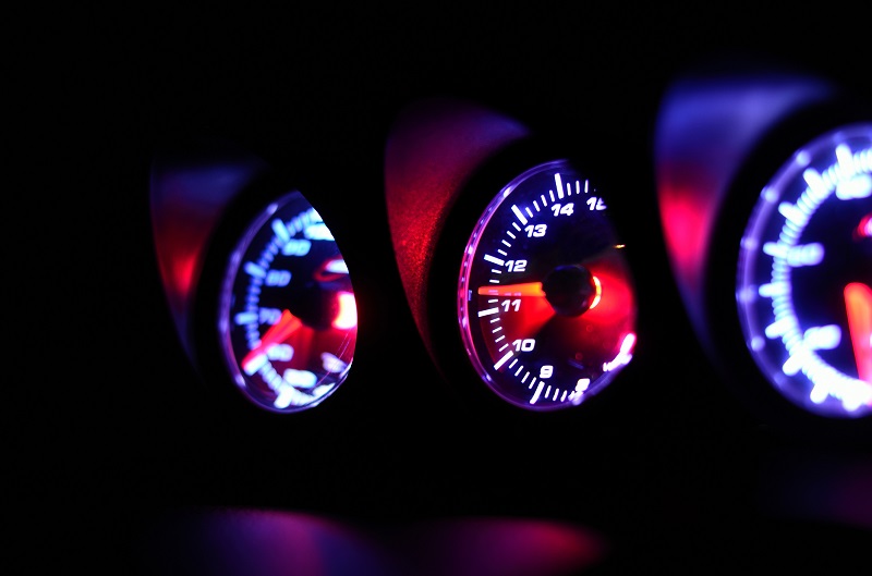 A car's dashboard meters.