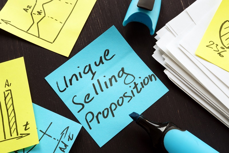 A sticky note that reads 'unique selling proposition'.