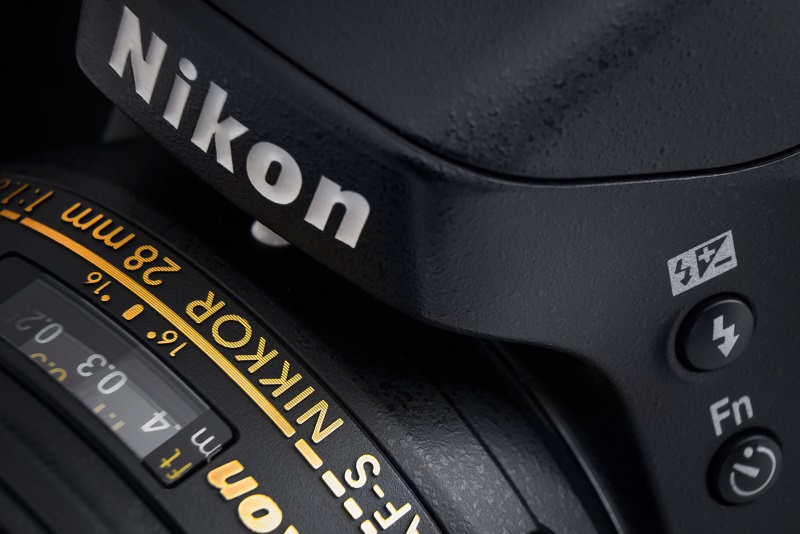 A Nikon camera lens close-up.