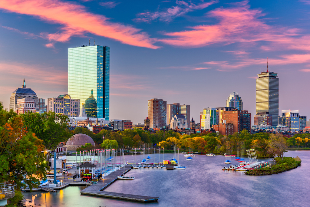 A view of Downtown Boston with harbor and skyline.