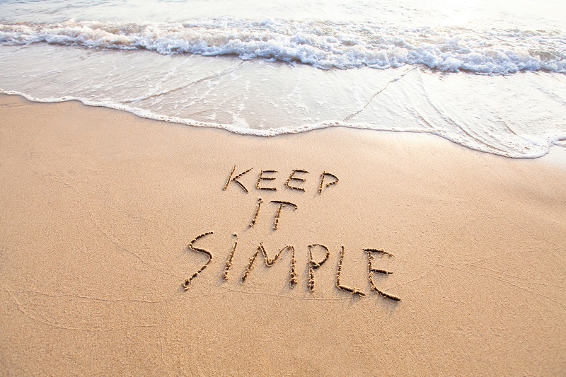 A beach with the words 'Keep it simple' written into it.