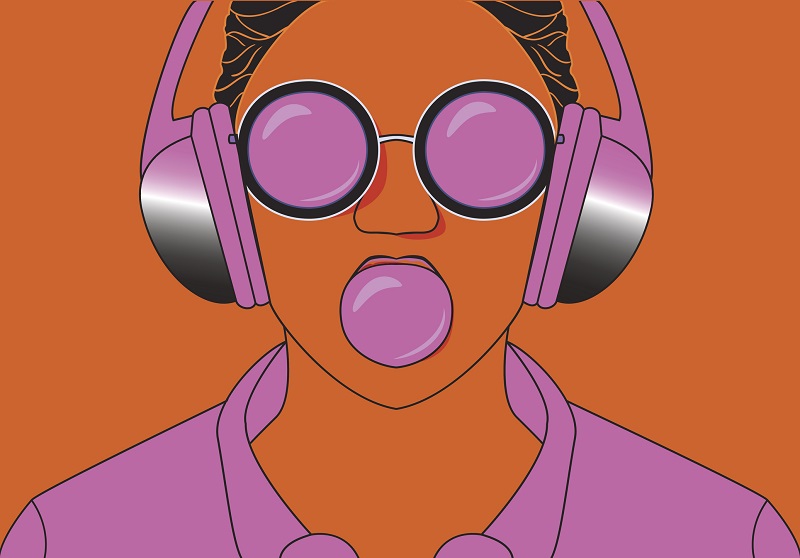 A young woman listens to purple headphones.