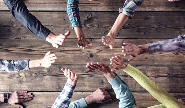 Hands coming together, congratulating each other.