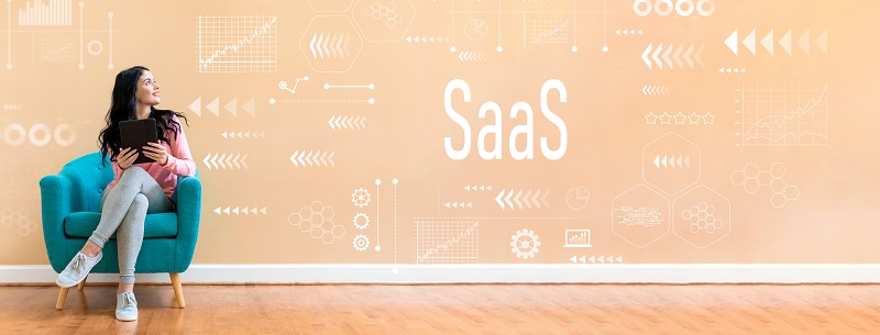 A woman on a chair next to the word 'SaaS'.