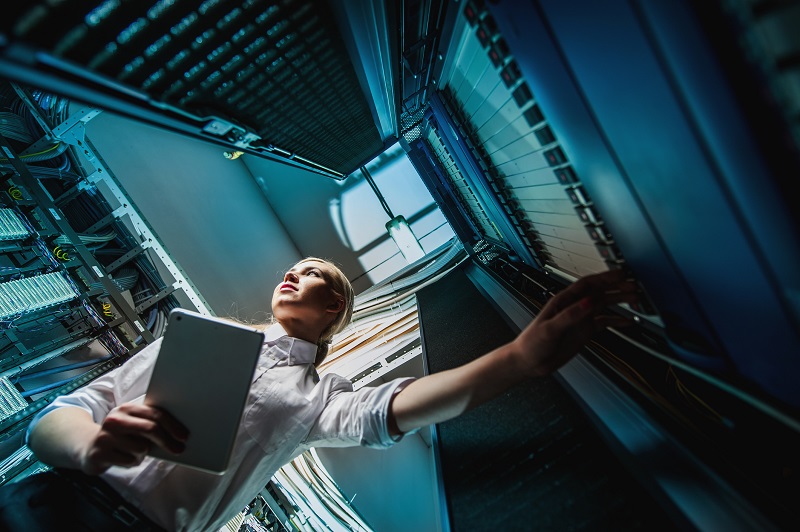 A woman checks on a server.