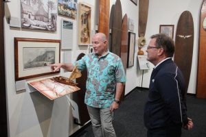 Glenn gives Canto's CEO, Jack McGannon, a tour of the SHACC gallery.