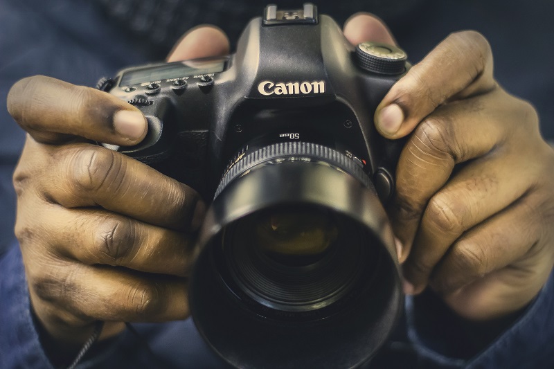 A man holding a camera.