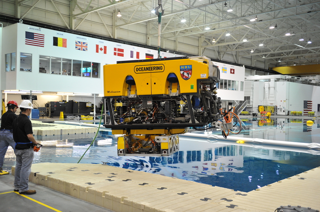 Oceaneerings technicians operating high-tech equipment.