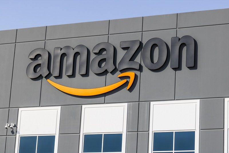 An Amazon building with their logo on the side.