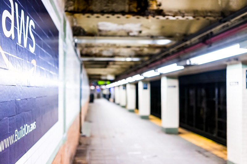 The AWS symbol painted on a subway wall.