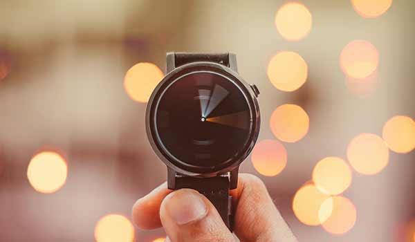 A person holding a watch.