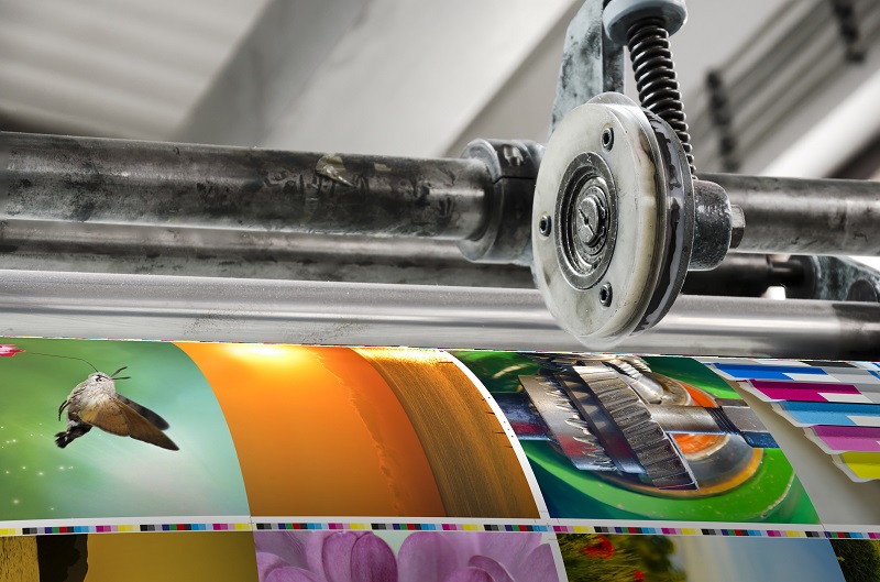 A printing machine with colorful images.