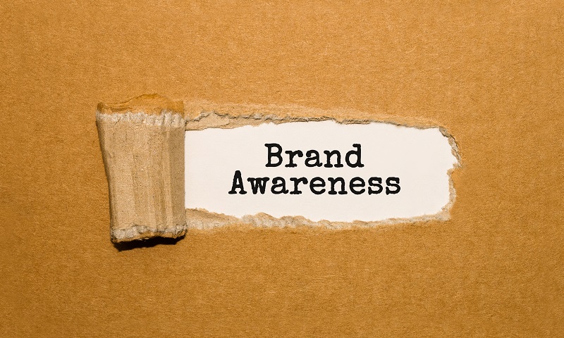 Cardboard that reads 'brand awareness'.