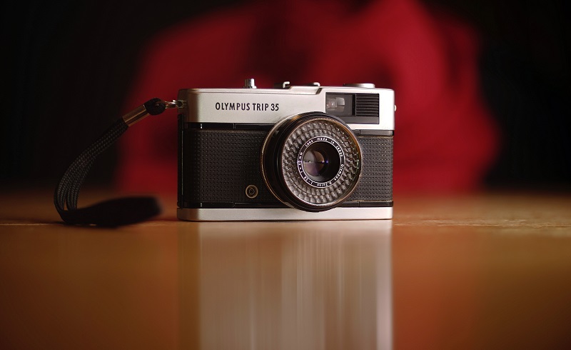 A retro Olympus camera.