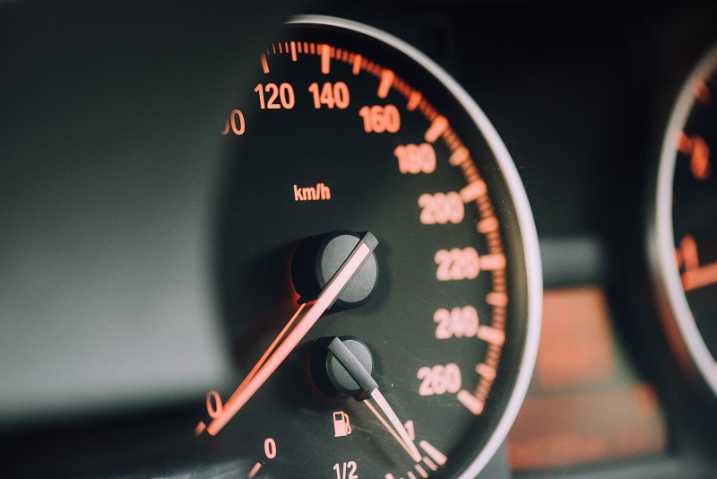 A speed guage on a car.