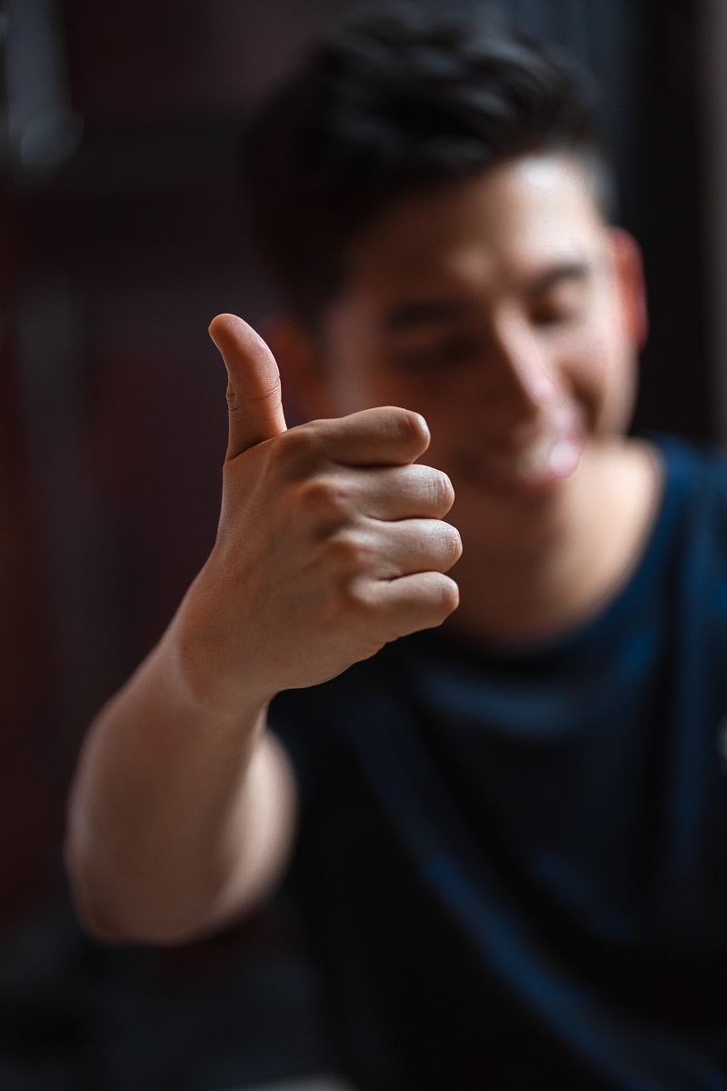 A man holding a thumbs up.