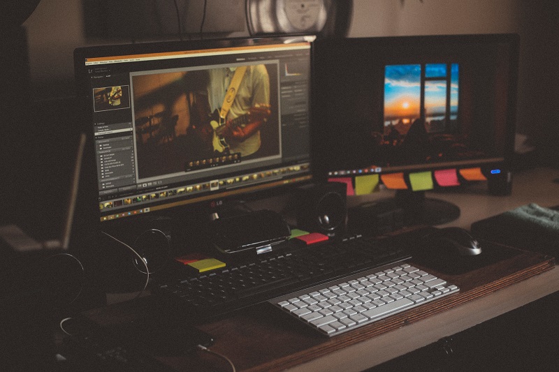 Two computer monitors editing a video.