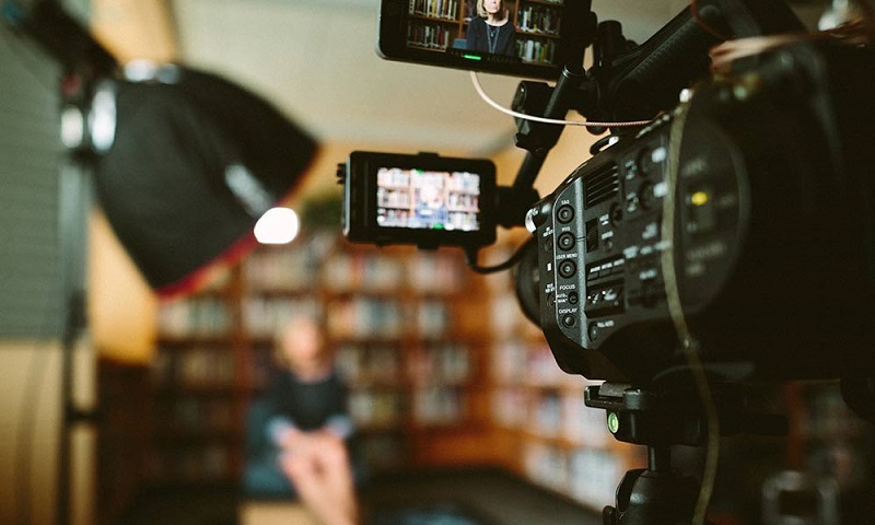 A woman filmed on camera.