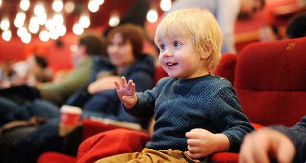 A young child at a movie theater.