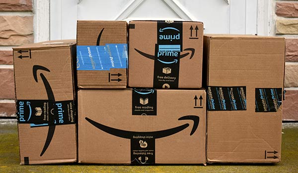 Amazon boxes on a porch.