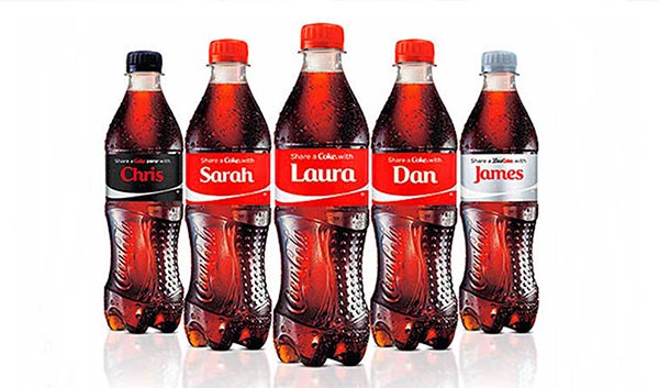 Coca-Cola bottles with personalized labels.