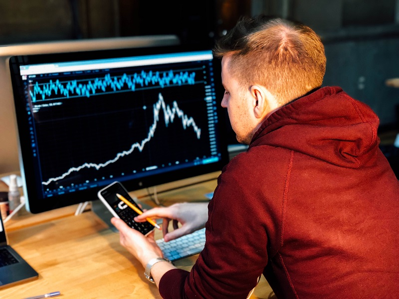 A worker studying graphs.