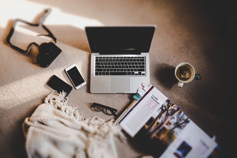 A laptop on the floor.