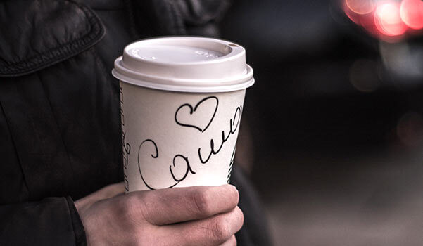 A coffee cup with a person's name on it.