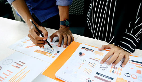 Two people going over documents.