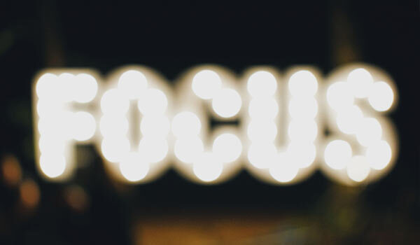 A lighted sign that reads 'focus'.