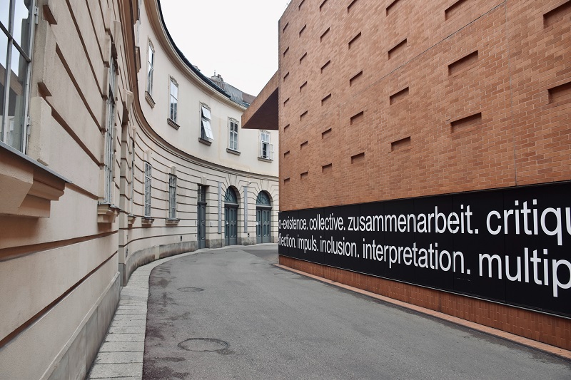 A building with a message on the side of it.