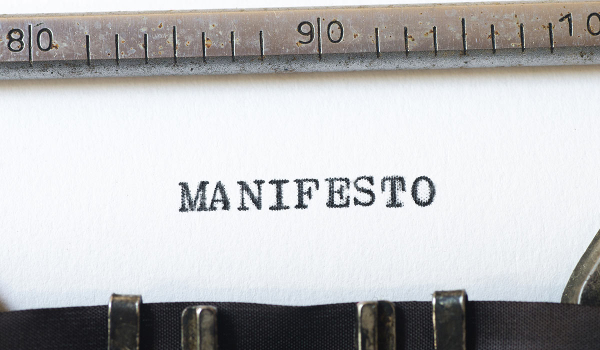 The word 'Manifesto' written on a typewriter.