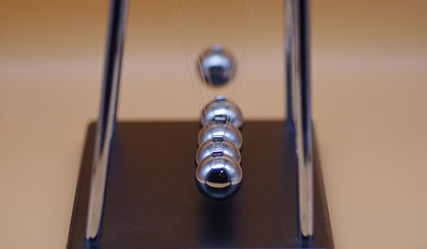 A swinging pendulum.