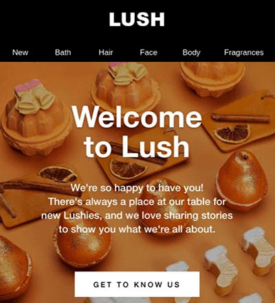 Screenshot of a welcome email from Lush featuring photo of orange-hued Lush products.