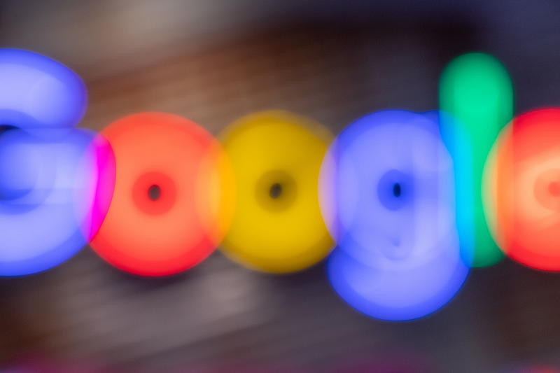 The Google logo blurred.