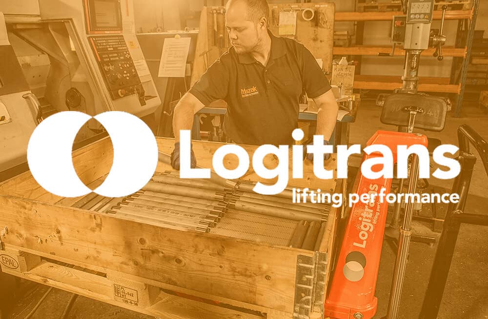 A worker in a warehouse as background for the brand name Logitrans.